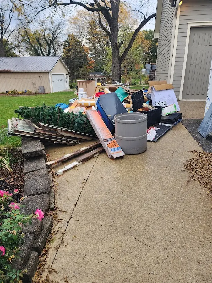 Dumpster being loaded with debris for Roofing Dumpster Rental in Lake San Marcos